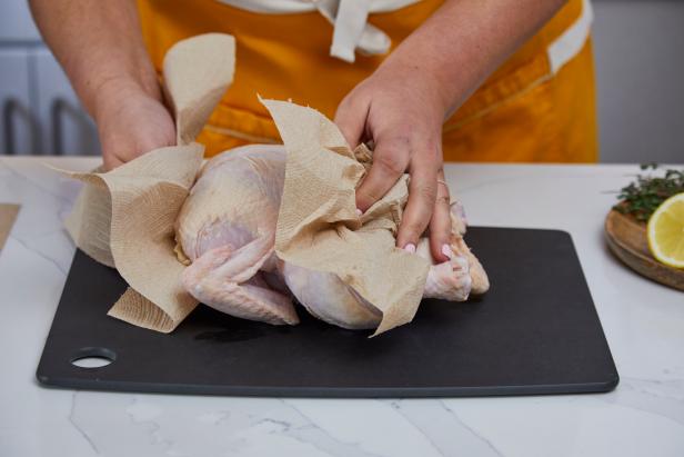 First, pat your chicken dry. This makes it easier to handle and prevents it from slipping.