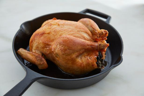 Trussing a chicken helps it keep its shape and cook more evenly.