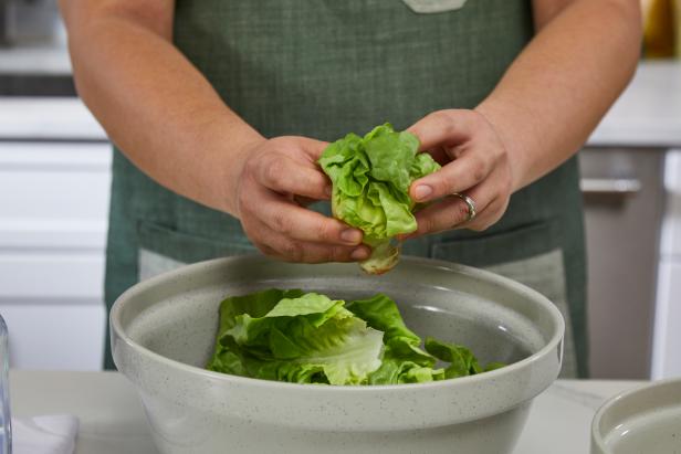 Look over your salad greens to make sure they're healthy. Discard any bruised or wilted leaves.