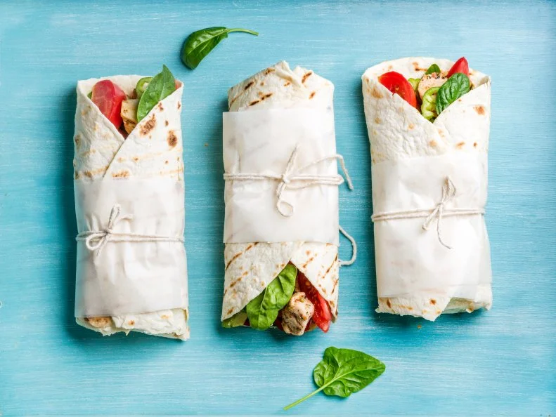 “My favorite healthy lunch right now isn’t actually too dissimilar from what I normally eat!” says <a target="_blank" href="https://www.sarahaasrdn.com/">Sara Haas, RDN, LDN</a> author of <a target="_blank" href="https://www.amazon.com/Taco-Ultimate-Cookbook-Recipes-Everybody/dp/1578267528/ref=sr_1_2?s=books&ie=UTF8&qid=1521758623&sr=1-2&refinements=p_27%3ASara+Haas">Taco! Taco! Taco!</a> and <a target="_blank" href="https://www.amazon.com/Fertility-Foods-Life-Giving-Nutritive-Recipes/dp/157826703X">Fertility Foods Cookbook</a>. Haas starts with a whole grain wrap and tops it with hummus, crispy chickpeas, feta cheese, any leftover cooked veggies in the fridge and homemade pickled red onions. “While I’m not vegetarian, I do find that I'm more satisfied after eating a veggie-loaded lunch. I also love the contrast of flavors and textures. The pickled onions are an all-time favorite. They’re not only beautiful, but add the perfect tartness to balance out the earthiness of all of those veggies!”