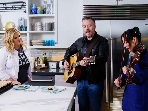 Host Trisha Yearwood, and special guests Jason Isbell and Amanda Shires as seen on Trisha’s Southern Kitchen, Season 16.