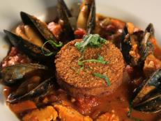 <p>Chef and owner Greg Schwab broke free of the corporate world to bring seasonal and regional seafood favorites to Portland, Oregon. His take on cioppino is packed with seasonal, local fish and topped with a crispy, fresh Dungeness crab cake.</p>