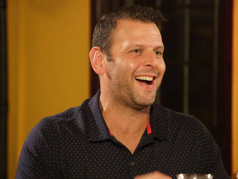 Enjoying dinner with his family, Jesse Foy, owner of Diamond Point Grille, discusses the successful summer season, as seen on Summer Rush, season 1.