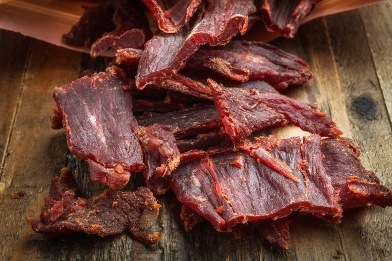 Sink your teeth into the ultimate 1-ingredient, hand-held snack. Jerky is a shelf stable and affordable high protein food that comes in a wide variety of flavors.