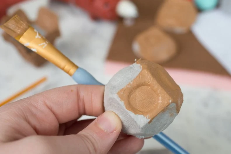 Paint a light tan or whatever color you want for the dough base of your cookie. Set aside to dry completely. 