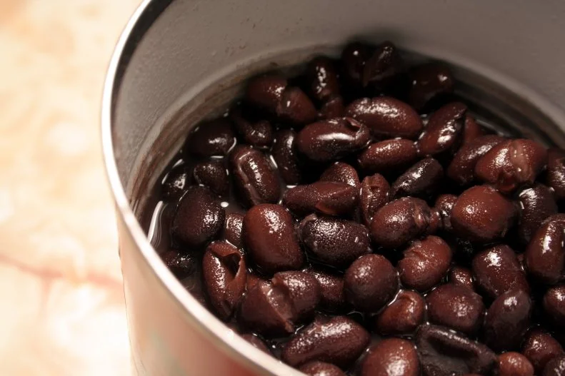 “I like to bring along canned beans because they are rugged—you can drop them or knock them over and they won’t leak or break, they require no refrigeration, and they are so versatile,” says Sharon Palmer, MSFS, RDN, <a target="_blank" href="https://sharonpalmer.com/">The Plant-Powered Dietitian</a>. In addition, canned beans are a great source of protein, fiber, and essential vitamins and minerals. Plus, they can be the star of your plate, because of the protein source. “We should be eating beans at least a few times per week, according to research on health benefits, such as lower risk of heart disease, type 2 diabetes, and obesity,” says Palmer. A few meal ideas Palmer recommends is adding the beans to a bagged salad mix with dried fruit for a hearty salad, adding to a simple vegetable soup, or to pasta and tomato sauce. You can also add them to a veggie wrap or burrito. Just don’t forget a can opener!
