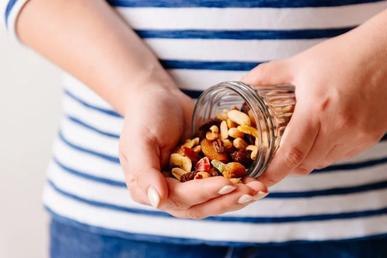 <a target="_blank" href="https://www.malinamalkani.com/">Malina Malkani</a>, MS, RDN, CDN, creator of <a target="_blank" href="http://solvepickyeating.com/">Solve Picky Eating</a> and author of <a target="_blank" href="https://www.malinamalkani.com/simple-safe-baby-led-weaning-book">Simple & Safe Baby-Led Weaning</a> recommends packing any and all kinds, including almonds, peanuts, cashews, walnuts, pistachios and hazelnuts. “Nuts don’t take up a lot of space and are perfect for travel because they are shelf-stable, energy-dense and a fantastic source of plant-based protein, vitamins, minerals and antioxidants,” says Malkani. “My girls and I love them plain or tossed into a trail mix with dried fruit.”
