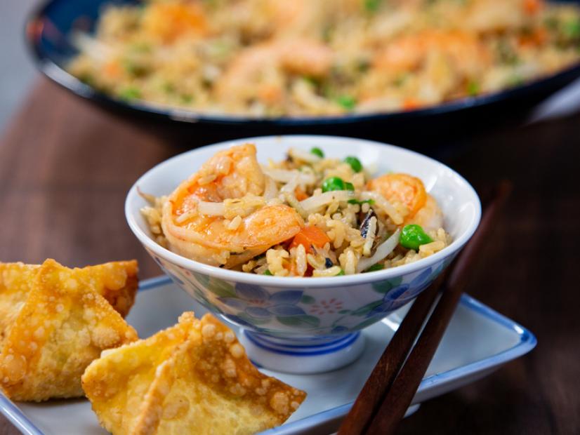 Hosts Adeev and Ezra's fried rice with crab rangoon, as seen on Takeout Twins, season 1.