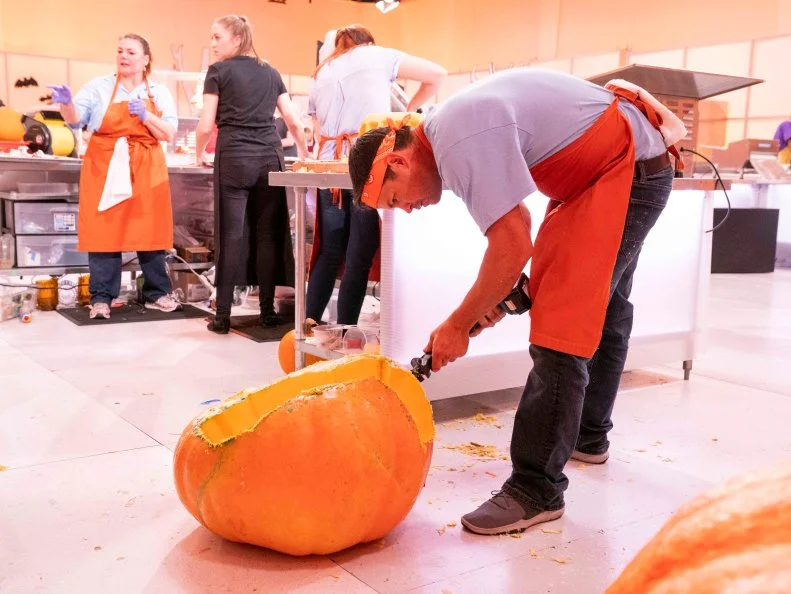Contestants, Candy Coroners work on their cake to win the challenge, as seen on Halloween Wars, Season 10.