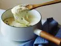 pommes aligot, garlic, yukon gold, bay leaf, heavy cream, butter, shredded Gruyere, fresh mozzarella, chives,