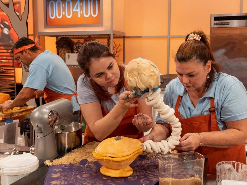 Left to Right: Team Candy Coroners Pumpkin Carver Chad Gaine, Cake Maker Amy McBride and Sugar Expert Janet Baron at work during Episode 2 Small Scare challenge "The Unfortunate Fortune-Teller." as seen on Halloween Wars, Season 10.