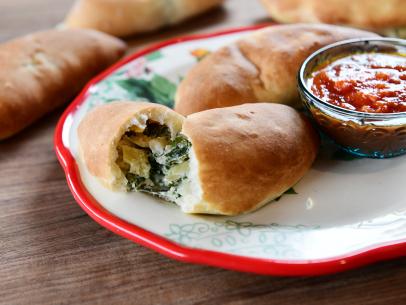 Close-up of Spinach Artichoke Calzones, as seen on The Pioneer Woman, season 25.