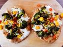 Close-up of Broccoli and Tomato Flatbread Pizzas, as seen on The Pioneer Woman, season 25.