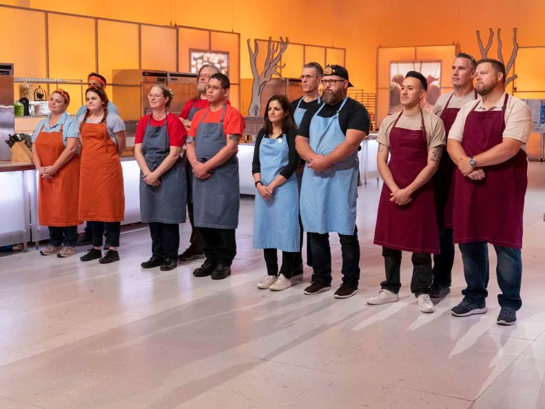 Left to Right, team Candy Coroners, Ghoul-Icious, Mummies Rejects and Crave Diggers listen to instructions for the Episode 3 Small Scare challenge, as seen on Halloween Wars, Season 10.