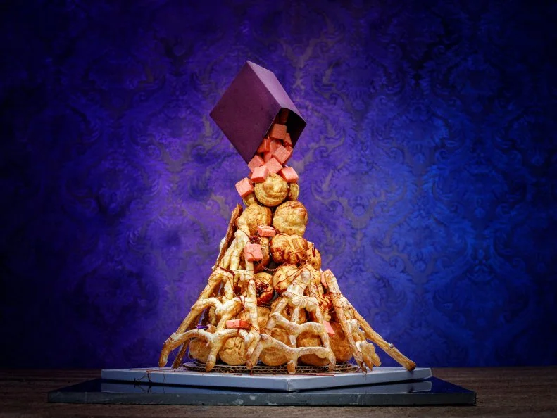 Contestant Brian Bosch  STRAWBERRY CANDY/SPIDERWEBS .CROQUEMBOUCHE  FILLED W/ STRAWBERRY AND PUMPKIN MOUSSE WITH A HINT OF RUM.SPIDERWEB PATE A CHOUX FENCE, as seen on Halloween Baking Championship, Season 6.