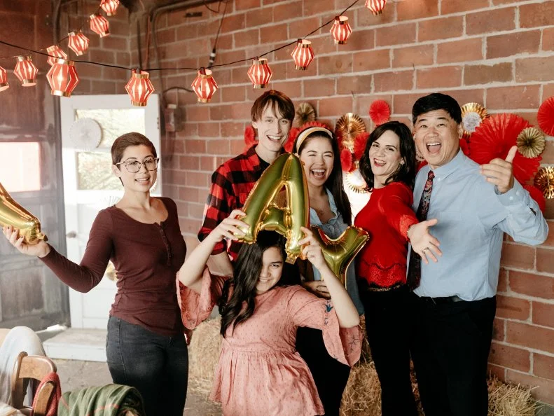 Host Molly Yeh celebrates Chinese New Year with her family, sisters Mia and Jenna, husband Nick, stepmom Teresa, and dad John, as seen on Girl Meets Farm, Season 2.