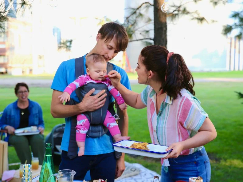 Molly jokingly tries to get her baby to try a Radish ,as seen on Girl Meets Farm, Season 4.
