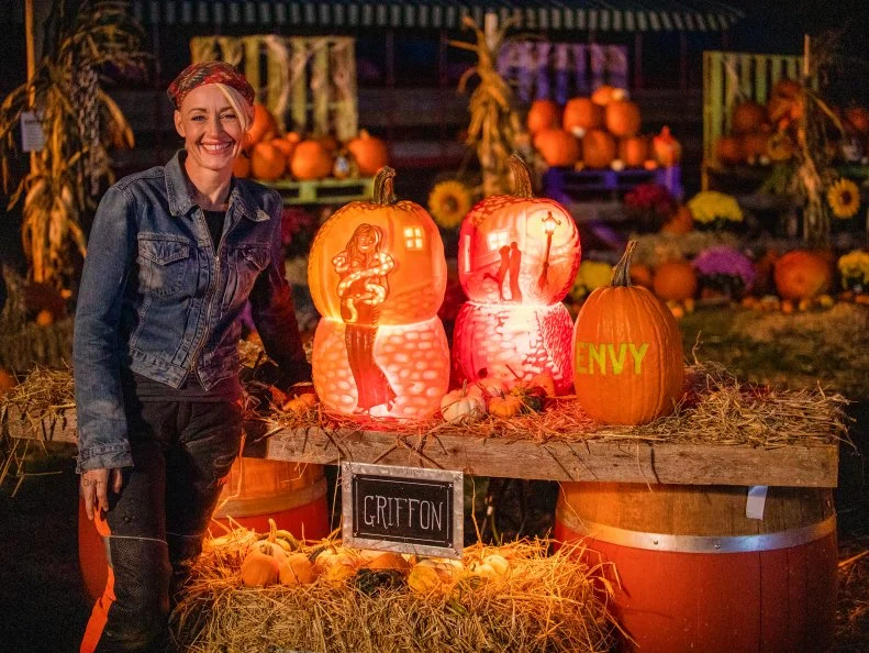 Contestant, Griffon Ramsey, Episode 1, Round 2, posing with finished pumpkin, as seen on Outrageous Pumpkins, season 1.