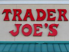 PINECREST, FL - OCTOBER 18: The Trader Joe's sign is seen during the grand opening of a Trader Joe's on October 18, 2013 in Pinecrest, Florida. Trader Joe's opened its first store in South Florida where shoppers can now take advantage of the California grocery chains low-cost wines and unique items not found in other stores. About 80 percent of what they sell is under the Trader Joe's private label. (Photo by Joe Raedle/Getty Images)