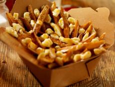 Hand Cut French Fries with Cheese Curds and Gravy in a Cardboard Take Out Box - Photographed on Hasselblad H3D2-39mb Camera