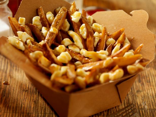 Hand Cut French Fries with Cheese Curds and Gravy in a Cardboard Take Out Box - Photographed on Hasselblad H3D2-39mb Camera