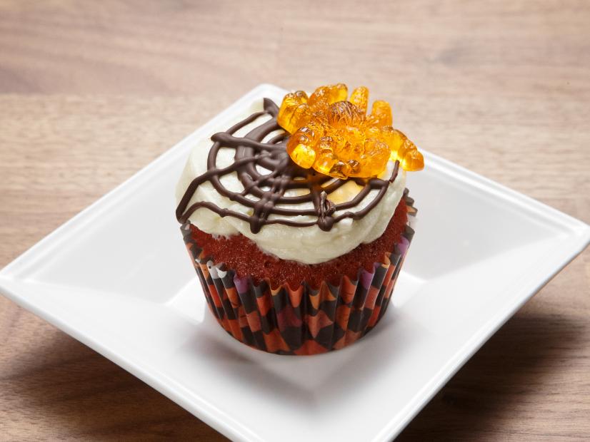 The red team's Red Velvet Cupcake with Mascarpone Frosting and Dark Chocolate Spiderweb is displayed, as seen on Worst Cooks in America Halloween Special.