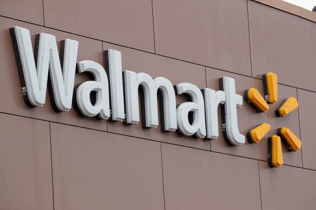 CHICAGO, IL - JANUARY 11:  A sign hangs outside Walmart store on January 11, 2018 in Chicago, Illinois. Walmart announced today it would use savings from the recently revised tax law to increase their starting wage to $11-per-hour, offer some hourly employees a one-time bonus up to $1000, expand maternity and parental leave benefits and will begin to offer adoption assistance. The company also disclosed today that it would be closing 63 of its Sam's Club stores across the US, costing thousands of workers their jobs.  (Photo by Scott Olson/Getty Images)