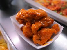 <p>The husband and wife team at Chick -n- Beer are taking wings to all different levels. They start with juicy, brined wings and dredge them in potato flour for a light crunch, then double fry and coat them in one of their many sauces, like Buffalo-style kicked up with Sriracha or tangy szechuan Parmesan.</p>