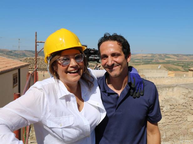 Piero Verardo and Lorraine Bracco check on the construction of the roof of her Sicilian home, as seen on HGTV's My Big Italian Adventure.