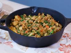 Save space in the oven on the big day with this easy cornbread dressing. I start with a make-ahead buttermilk cornbread that has an extra depth of flavor, thanks to a dash of Dijon. A half hour before everyone sits down to the table, I saute some spicy sausage with Dijon mustard, vegetables, chestnuts and fresh herbs. After folding in the cornbread, the dish goes straight into a serving bowl -- leaving plenty of room for the other sides in the oven.