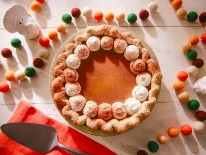 Food Beauty of Molly Yeh's Pumpkin Pie with Whipped Cream & Cinnamon ,as seen on Girl Meets Farm, Season 6.