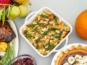 Outdoor table setting; overhead of Crowd Sourced Stuffing dish, as seen on Sunny Anderson Thanksgiving.