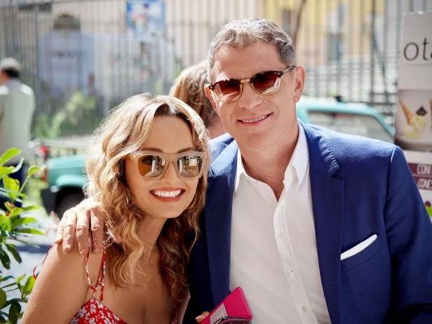 Bobby Flay and Giada De Laurentiis pose outside Otaleg gelato shop, as seen on Bobby & Giada In Italy, Season 1.