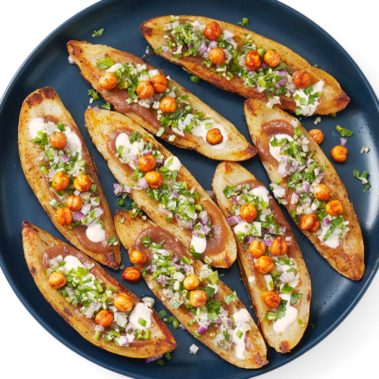 https://food.fnr.sndimg.com/content/dam/images/food/fullset/2020/12/10/0/FNM_010121-Chaat-Potato-Skins.jpg.rend.hgtvcom.1280.1280.suffix/1607613566186.jpeg