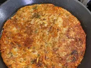 Close-up beauty of Egg/Sausage/Taleggio Casserole with Swiss Chard, as seen on Food Network's Feasting With The Stars.