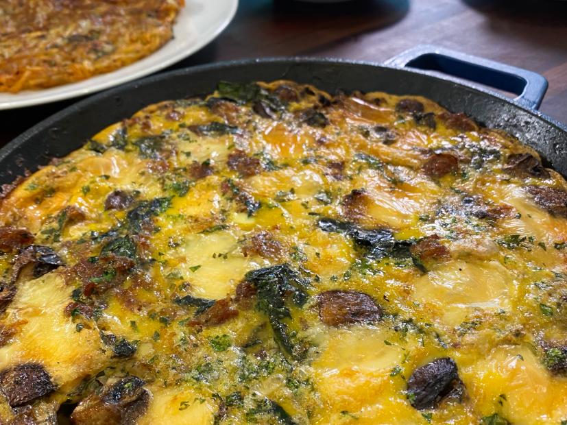 Close-up beauty of Egg/Sausage/Taleggio Casserole with Swiss Chard, as seen on Food Network's Feasting With The Stars.