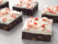 I always look forward to making peppermint bark during the winter holidays. Here I combine its flavors with a simple bittersweet brownie recipe. The brownies come together quickly and are the perfect base for the sweetness of the white chocolate and crushed peppermint candies.
