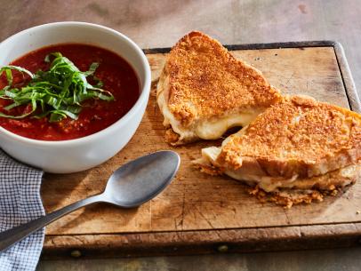 Food Network Kitchen's Tomato Soup for One with Parmesan Frico Grilled Cheese. Keywords: