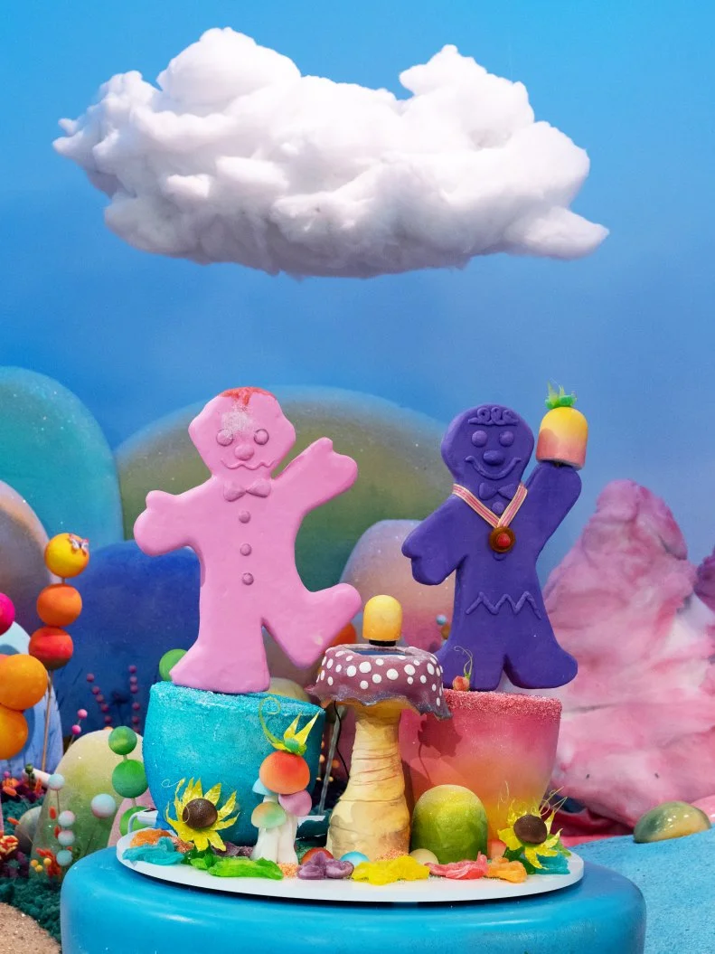 The cake titled "Don't Drop the Gumdrop!" created by the pink team contestants Alexis Nicole, Andrew Fuller, Mona Marwaha and Robert Nieto, as seen on Candyland, Season 1.
