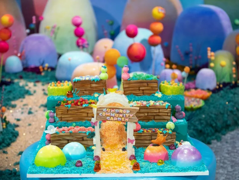The Cake called Gumdrop Community Garden created by contestants Deavynne Millward, Deva Williamson, Jewel Johnson, Ray Miranda-Vizcaino, as seen on Candyland, Season 1.