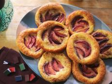 This is my version of a dessert that is popular all over North Dakota, South Dakota, and Minnesota. It is simply referred to as "kuchen," and while kuchen translates to "cake" in German, the specific style that is popular here refers to a yeasted dough topped with custard and usually (but not always) fruit. Around here, you can get it in grocery stores and farmers' markets, and it's often served at parties. I love it with a hot cup of coffee.