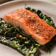 Alex Guarnaschelli makes Sheet Pan Blackened Salmon with Garlicky Kale, as seen on The Kitchen, season 27.