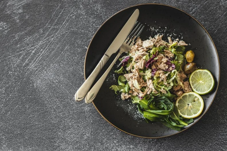 The amino acid tryptophan found in canned tuna signals the brain to release the feel-good chemical serotonin. This chemical helps promote calmness. Opt for tuna canned in water whenever possible.