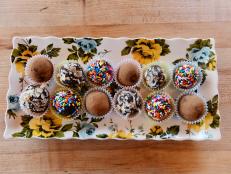 A brigadeiro is a traditional Brazilian sweet that is made with cocoa powder and sweetened condensed milk, then covered in sprinkles. These stay true to the classic Brazilian recipe, along with two favorite alternative topping options, coconut and cocoa powder. These treats are quite sweet, almost like a chocolate caramel, but the cocoa powder and toasted coconut will temper some of the sweetness.