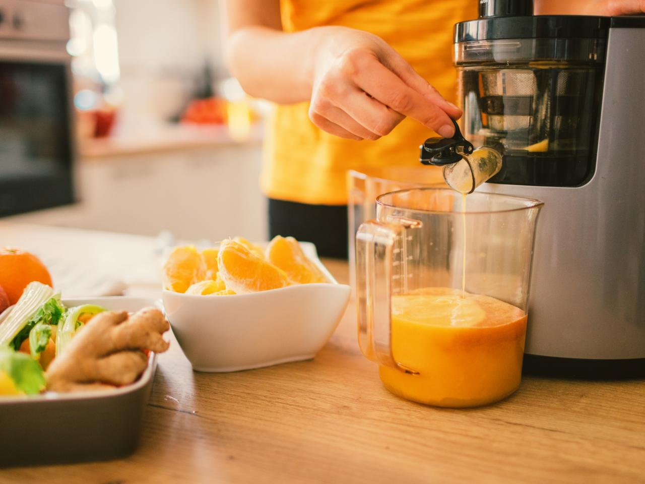 https://food.fnr.sndimg.com/content/dam/images/food/fullset/2021/01/22/0/FN_woman-making-cold-pressed-juice_s4x3.jpg.rend.hgtvcom.1280.960.suffix/1611333473353.jpeg