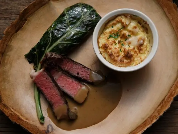 Smoked Rib Eye With White Gravy, Collard Greens And Grits Souffle 