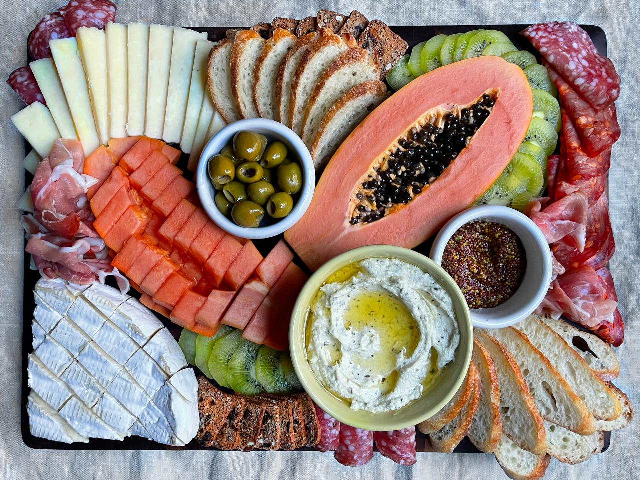 https://food.fnr.sndimg.com/content/dam/images/food/fullset/2021/02/26/giant-cheese-and-charcuterie-board.jpg.rend.hgtvcom.1280.960.suffix/1614607289202.jpeg