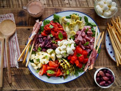 Beauty shot of Molly Yeh's Antipasto Salad w/Prosciutto Wrapped Breadsticks, as seen on Girl Meets Farm, Season 7.
