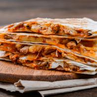 Quesadilla on a wooden table close-up shot