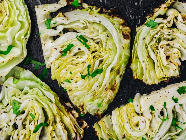 Baked or grilled white cabbage pieces with parsley